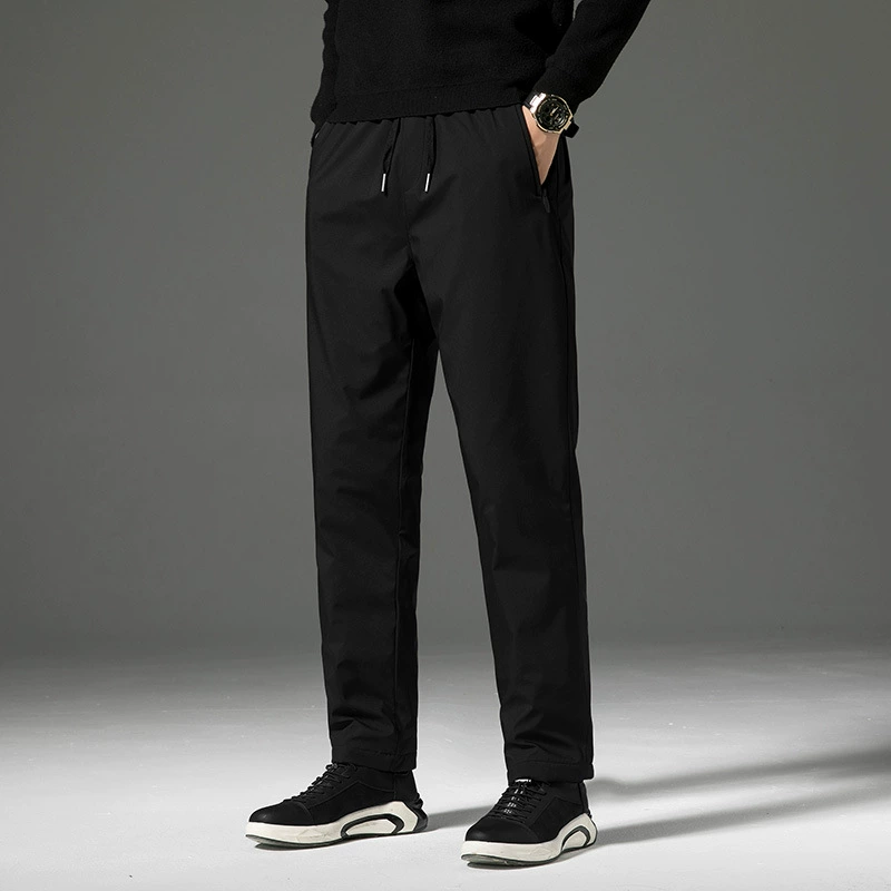 Белые утиные пуховые брюки для мужчин носят белые утиные пуховые брюки прямо зимой