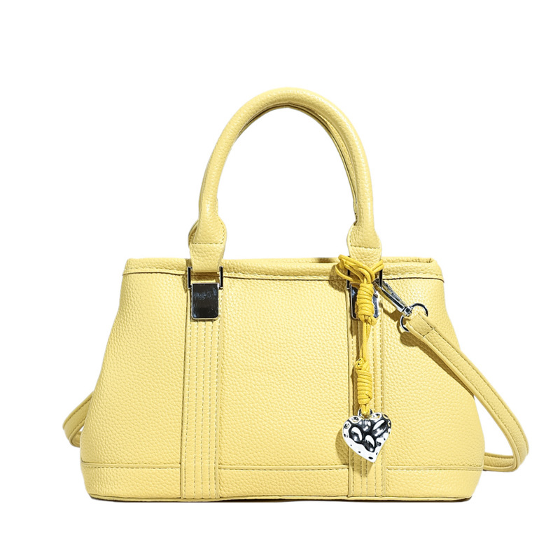 Versión coreana del bolso de nicho 2025 verano nuevo bolso femenino retro patrón de lichi bolso de hombro diario mensajero de viaje