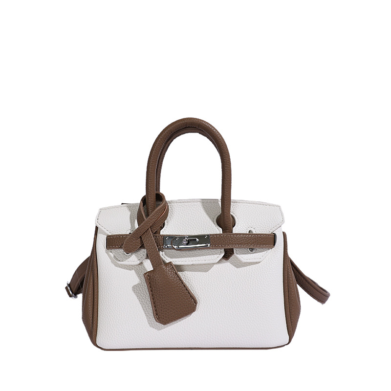 Bolso de platino portátil de litchi para mujeres 2026 comercio exterior nuevo estilo de alto nivel de sensación de tamaño de estilo de hombro mochila