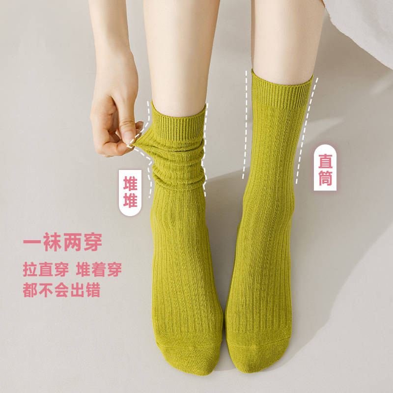 Calcetines de mujer de color sólido calcetines de media pantorrilla de primavera y otoño calcetines de pila de color caramelo de algodón peinado de mujer Zhuji calcetines largos de mujer al por mayor