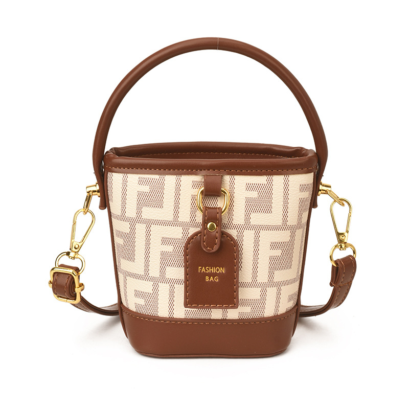Mini pequeño bolso de cubo de mano para niños 2026 nuevo estilo de alta calidad de moda versátil bolso de mochila de estilo exterior