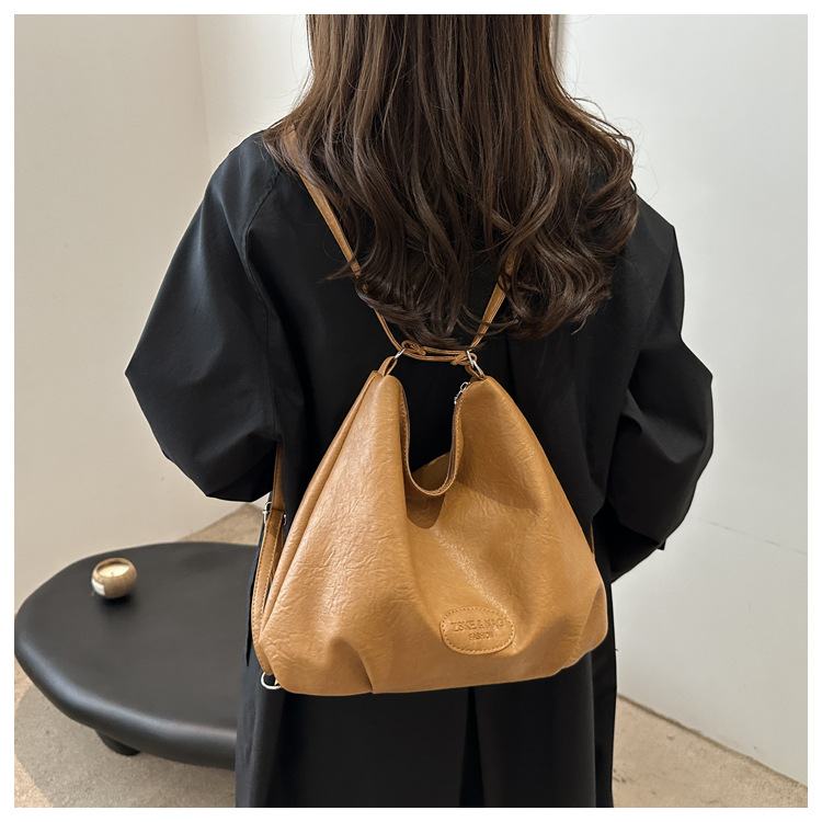The 2024 new pleated tote bag is a large-capacity casual and fashionable backpack for women, featuring multi-functional texture and a single-shoulder crossbody bag undefined