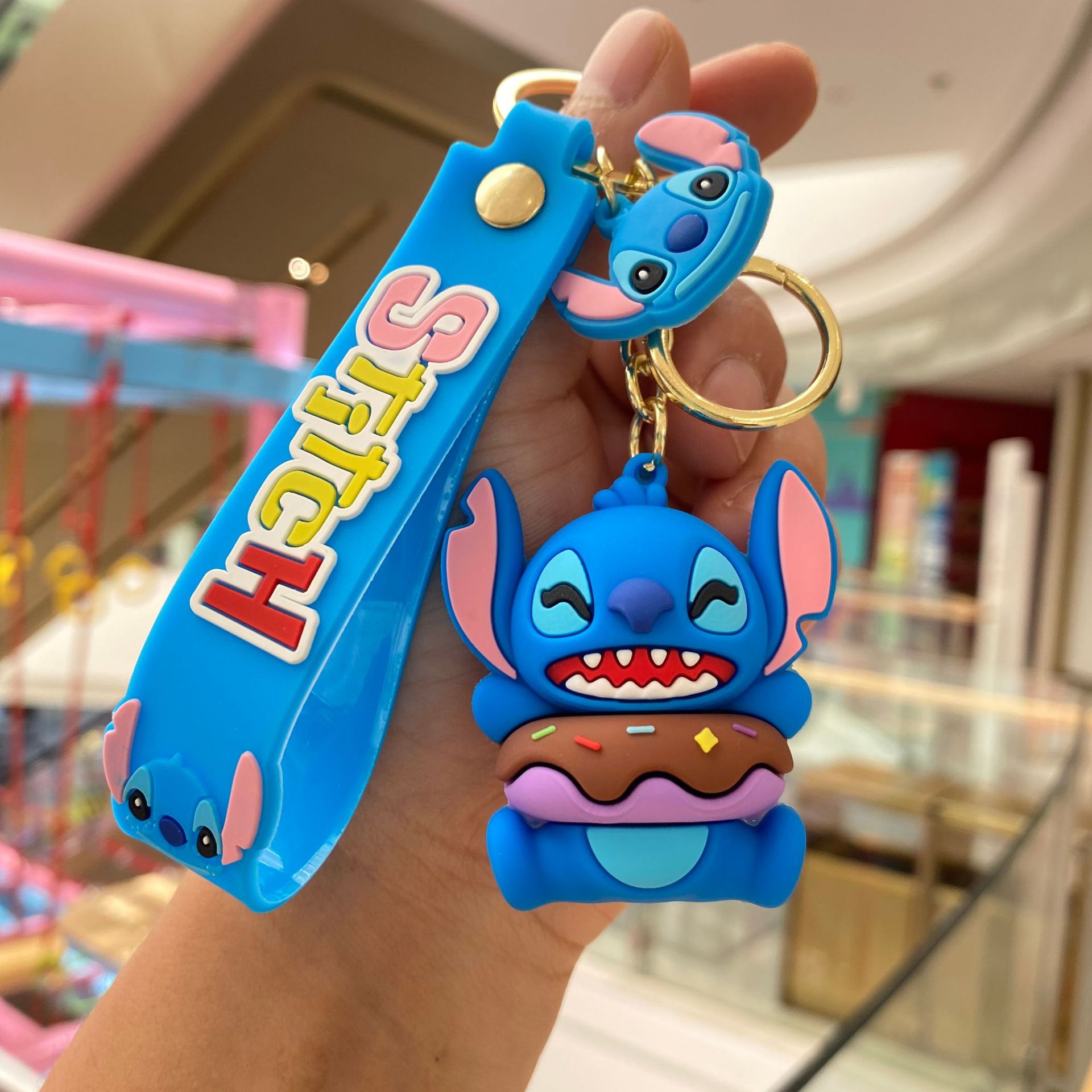 Dibujos Animados transfronterizos codiciosos puntada llavero colgante bolsa coche llavero muñeca rascando máquina regalo al por mayor