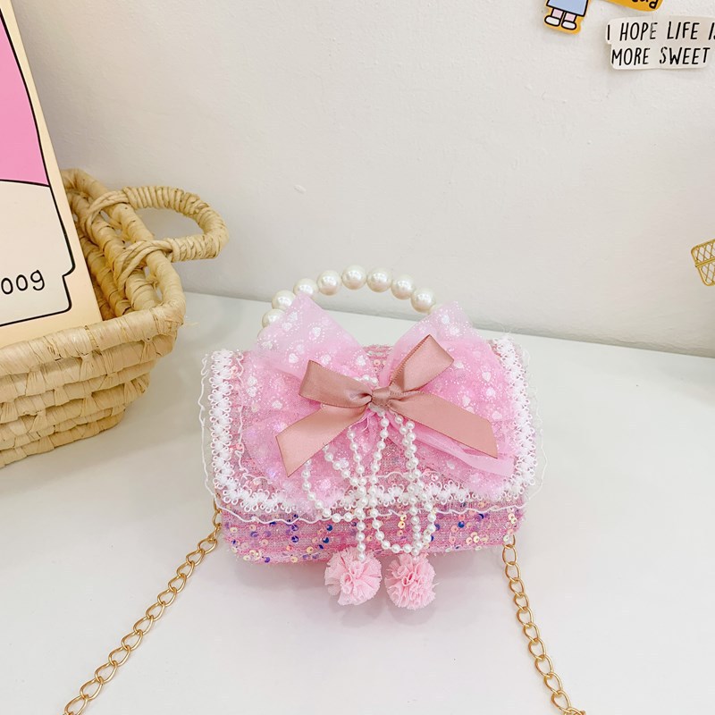 Otoño y invierno coreano arco camellia bolsas de niños de encaje de mano perlas bolsas mochilas para niñas de jardín de infantes