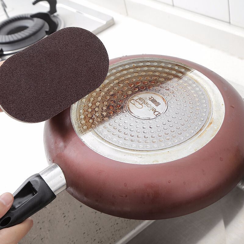 Magic sponge scrubber with handle for cleaning pots, washing dishes, removing black grime from pot bottoms, removing dirt and rust, and cleaning Magic sponge scrubber with handle for cleaning pots, washing dishes, removing black grime from pot bottoms, removing dirt and rust, and cleaning