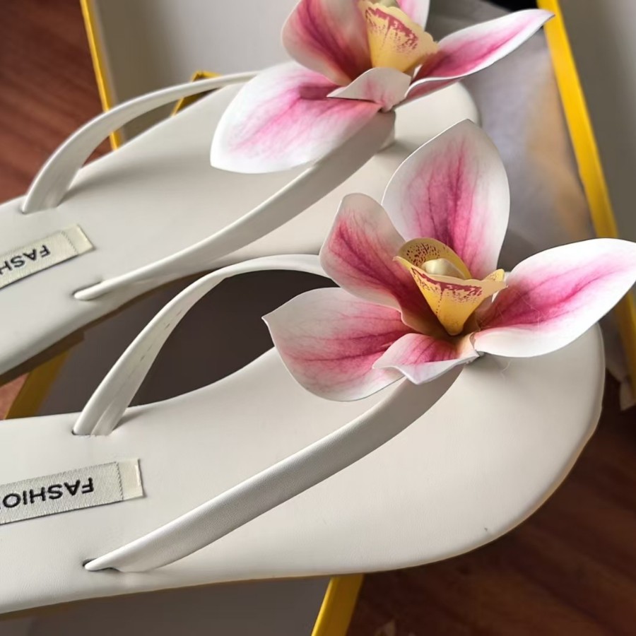 Chanclas con flores, sandalias tipo thong, exportadas por tiendas departamentales, textiles para el hogar, EVA