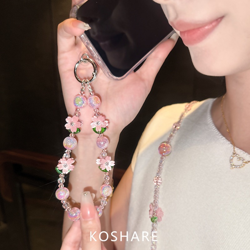 Flor de melocotón brillante cadena de teléfono móvil ligera de lujo de alto nivel colgante de cristal de moda anti-caída colgante de mano perlas para mujeres