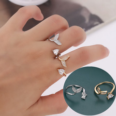 A copper ring with a fish-tail opening, slightly inlaid with zirconia, designed for women. It's a small-niche piece, suitable for the index finger, with a minimalist and versatile style. The ring is adjustable.