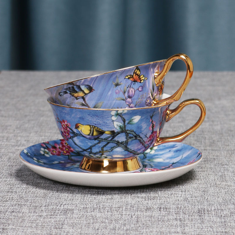 Flor y pájaro pintura oro hueso China taza de café platillo traje nuevo pequeño lujo Té taza de té