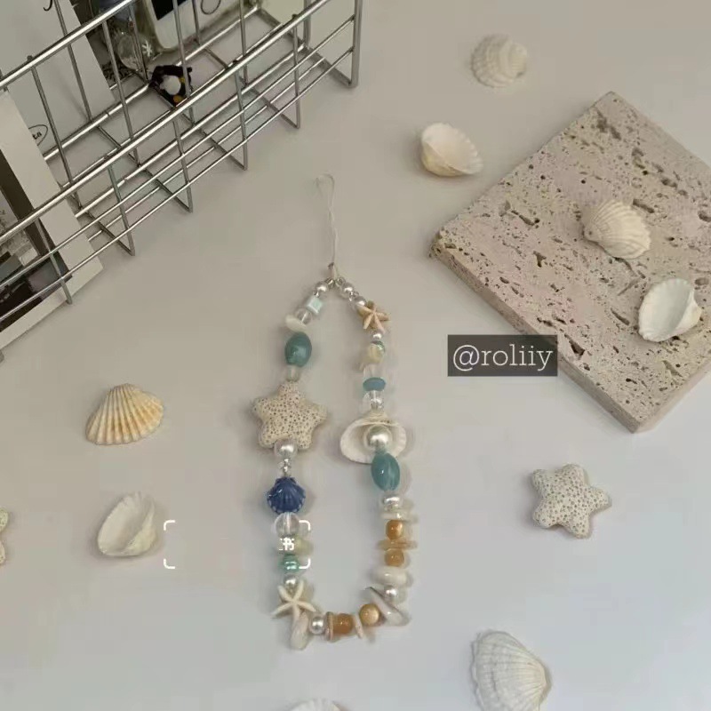 DIY starfish, pearl, and seashell phone charm; star-themed summer chain lanyard; CCD handmade camera pendant; DIY beaded charm.