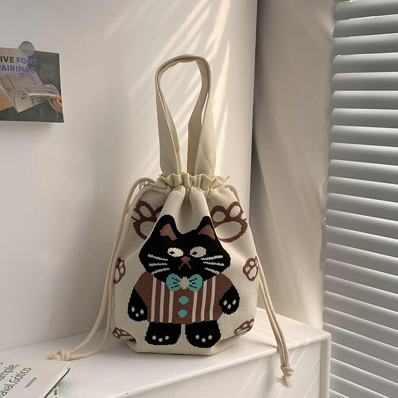 Bolsa de cinturón versátil nuevo patrón de dibujos animados nicho lindo bolso de arroz de almuerzo de cuerda bolso de cubo de mano bolso de brazo