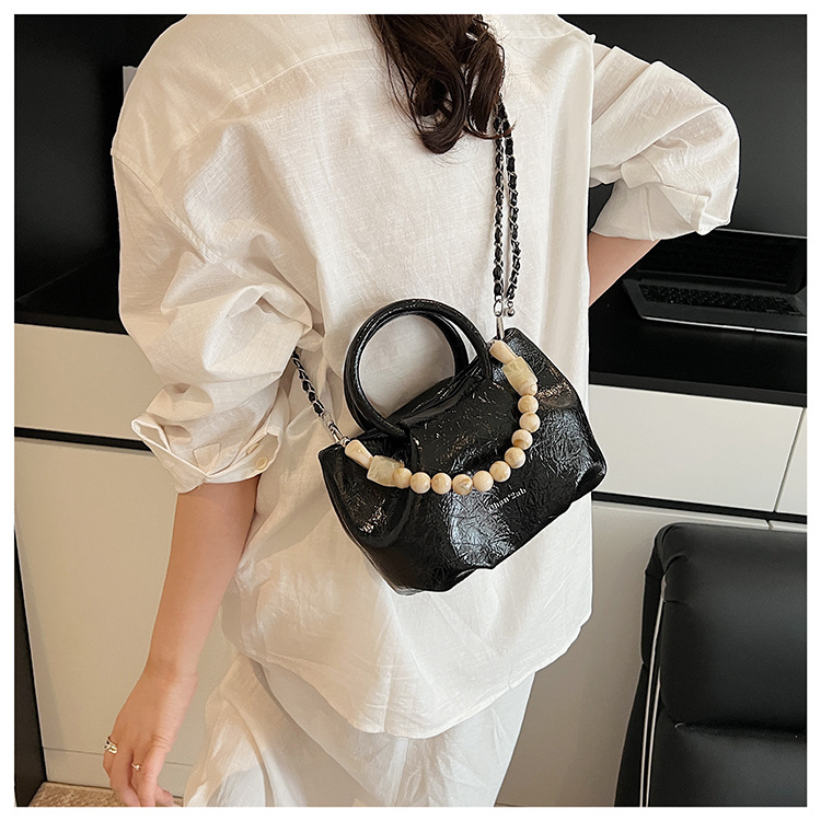 A stylish and trendy beaded bag for women, a new summer chain crossbody cloud bag for women in 2025 undefined