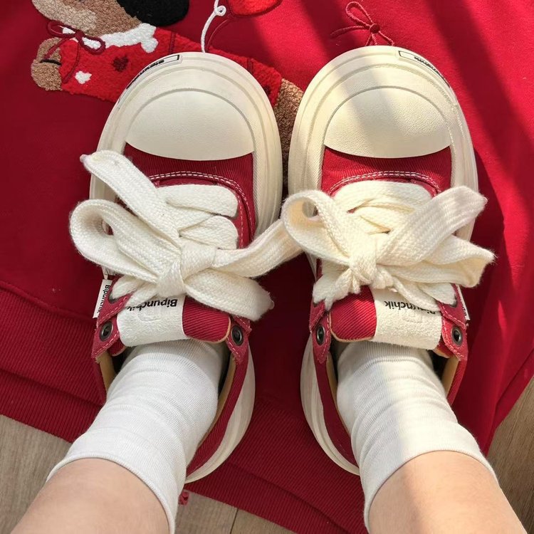 Zapatos de lona de vendaje negro y blanco pareja zapatos de cabeza grande de moda nacional de suela gruesa de moda masculina y femenina retro versátil zapatos de skate de altura
