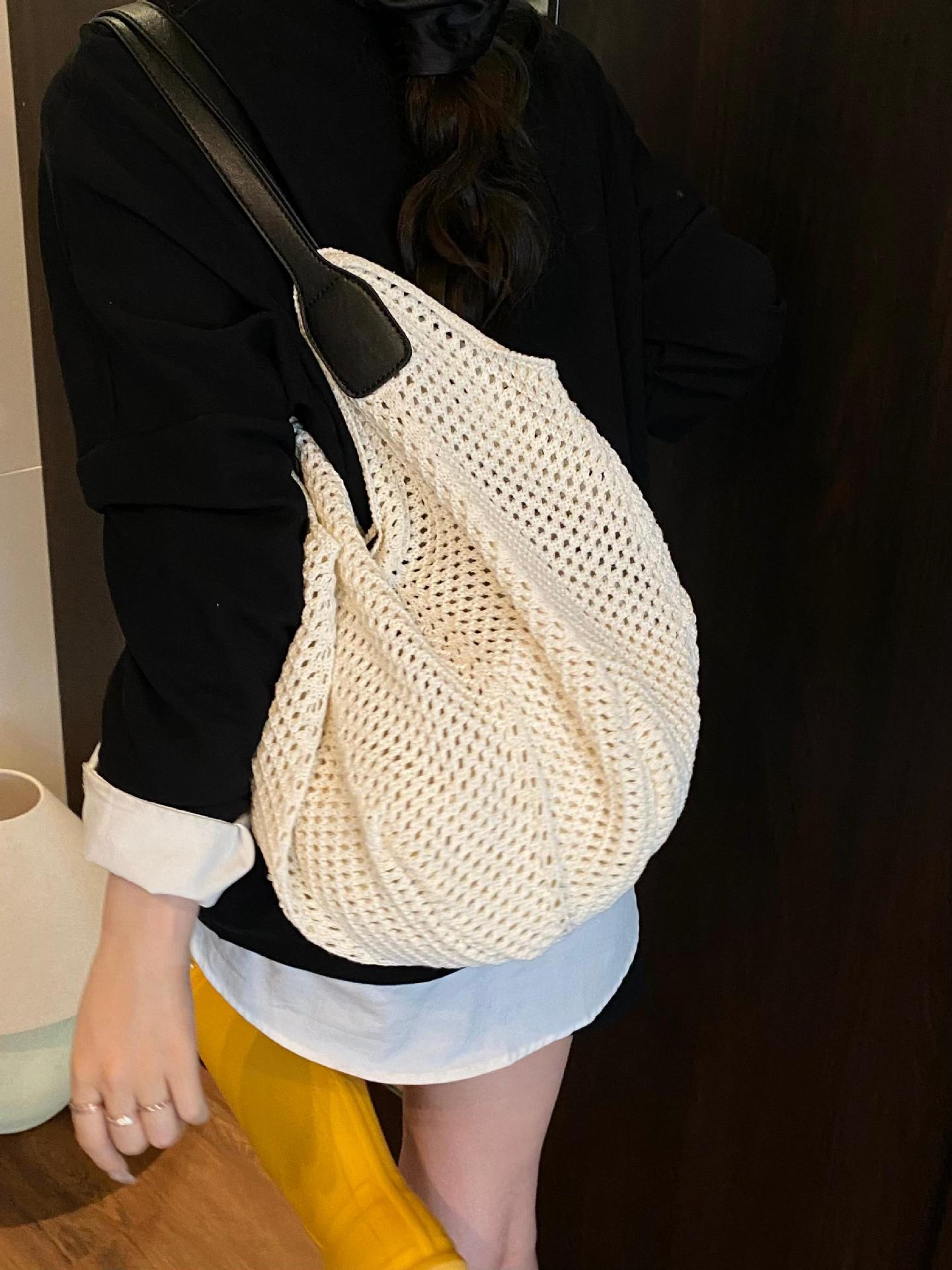 Bolso Tote de gran capacidad hueco tejido femenino 2025 nuevo bolso de playa de vacaciones junto al mar bolso tejido de paja de alta gama coreano