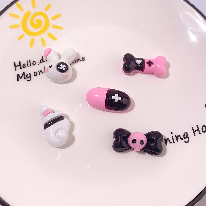 Caricatura dulce serie cool cráneo arco accesorios de resina DIY pegamento crema caja de teléfono móvil adornamiento de cabello agujero botón de zapato