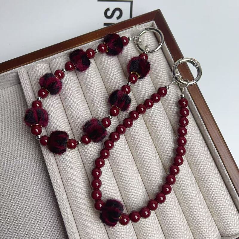 New high-grade retro Anke red fur ball mobile phone chain fashion temperament beaded bracelet bag key chain pendant