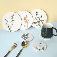 Customizable logo, absorbent, quick-drying, and heat-insulating coasters made of diatomaceous earth and cork for household and daily use.