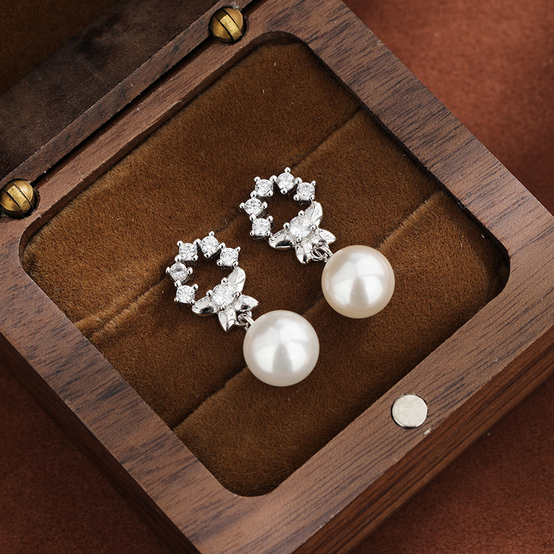 925 plata esterlina temperamento perlas perlas de verano alta sensación de moda flor de piedra arco pendientes para mujeres