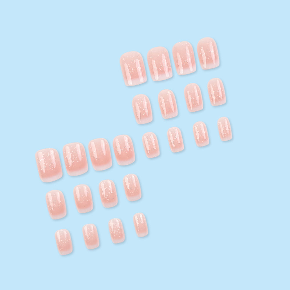 El método de uso de uñas europeas de brillo fino comercio exterior 24 piezas de uñas blanqueadoras suaves en un lote de uñas falsas de viaje