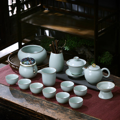 景徳鎮汝窯カンフー茶器セットは高級中国式陶磁器家庭用オフィスの蓋碗ギフトボックスを開けて包装します。
