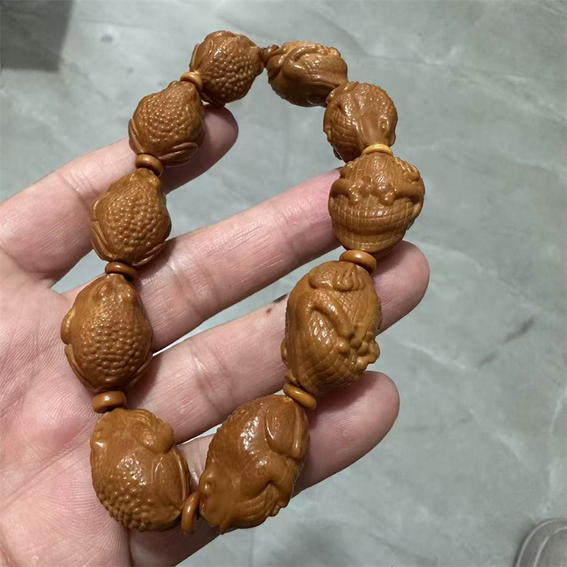 批发橄榄核雕刻财神貔貅佛手十八罗汉六字真言弥勒文玩佛珠手串