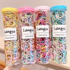 ネットの赤い爆発のキャンディー色の缶は輪の子供の高弾力の髪の縄の王女の赤ちゃんが髪の毛の皮の筋を刺して髪を傷つけません。