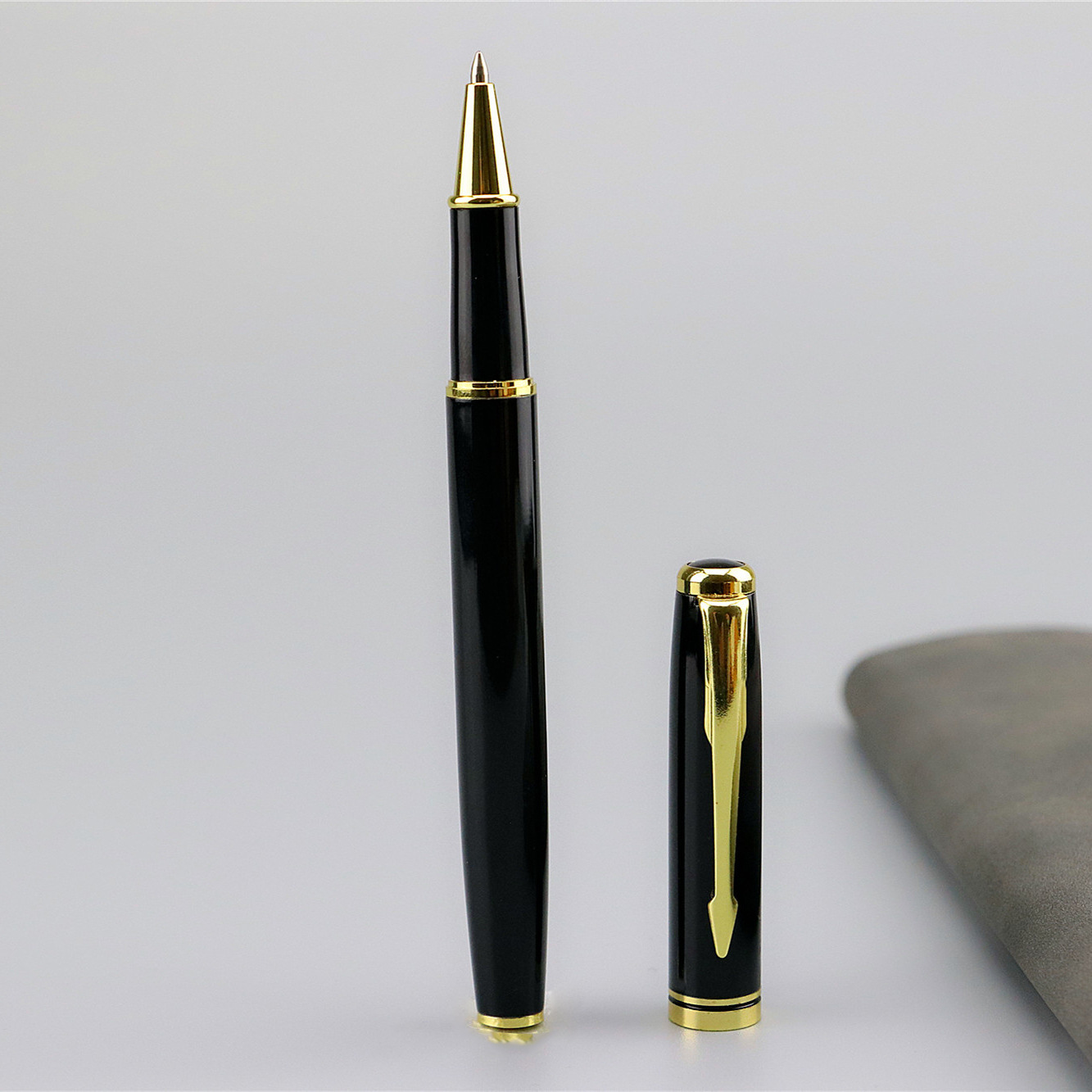 Fábrica al por mayor pluma de gel negro reunión de negocios regalo bolígrafo letras logotipo pluma de agua pluma de firma de metal