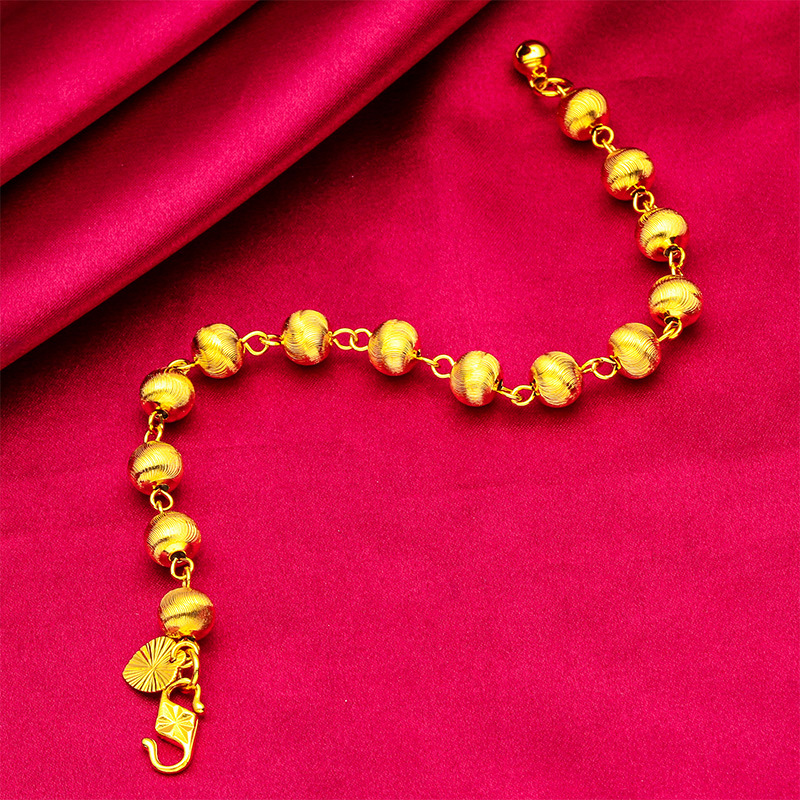 Pulsera unisex de moda con diseño de ojo de gato en oro y arena_voghion.com