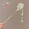 Golden Chinese hairpin white jade with tassels, orchid