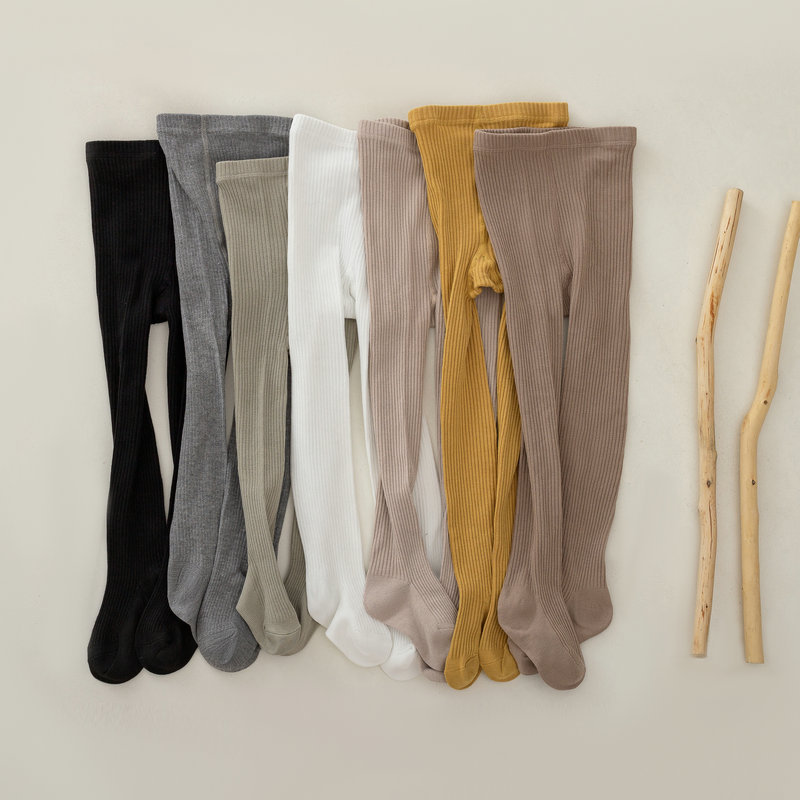 Nuevo color sólido rayas verticales polainas de las muchachas del otoño y el invierno estilo coreano ocasional los niños ropa exterior pantimedias blancas en stock