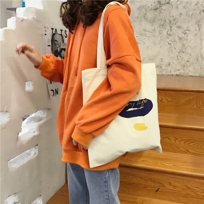 E131 canvas bag, Korean-style ins hand-held shoulder bag, color block letter graffiti shopping bag, female student's search for sources undefined