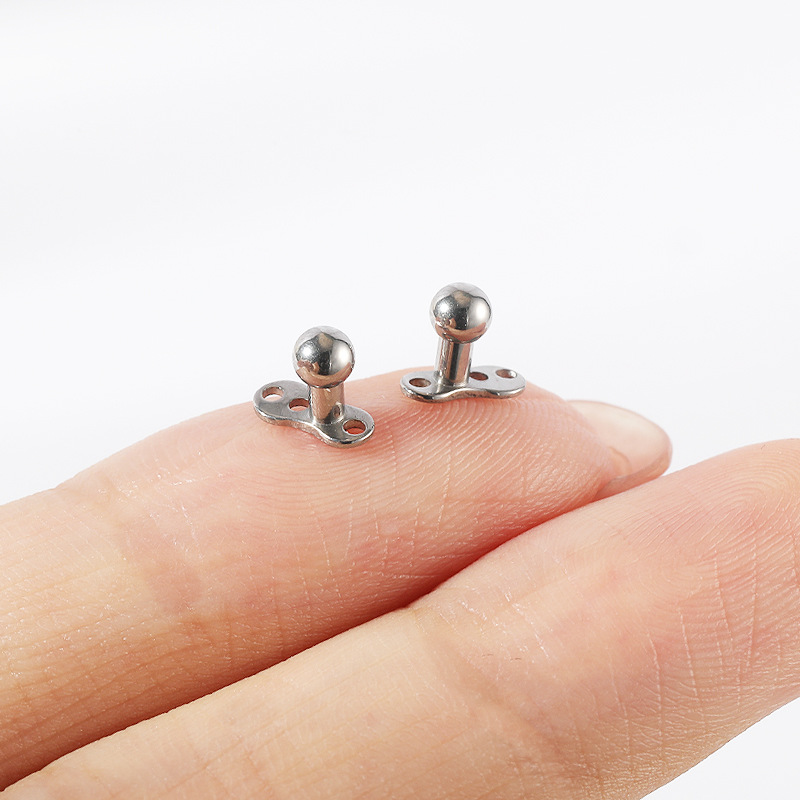 Silver pointed spike labret stud material detail