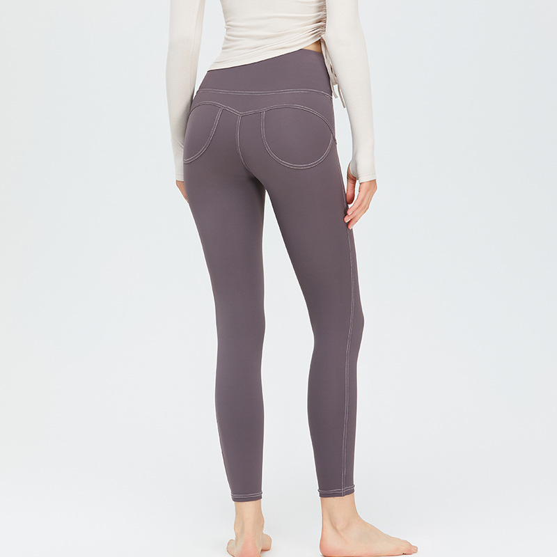 Nueva ropa de Yoga de las mujeres de Bolsillo falso elástico de la cadera melocotón pantalones de alta elástica Pantalones deportivos desnuda sensación sin T-line pantalones de yoga