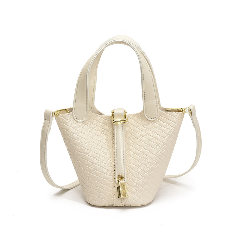 Bolso de cubo portátil con patrón tejido para mujer 2025 nuevo estilo coreano de lujo ligero de alta gama bolso de mensajero para niños de nicho