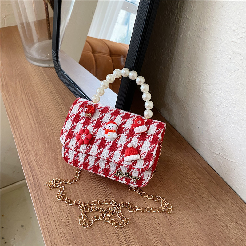 Mini moda para niñas bolso de cambio de perlas 2024 nuevo patrón de moda coreana bolso de ropa infantil