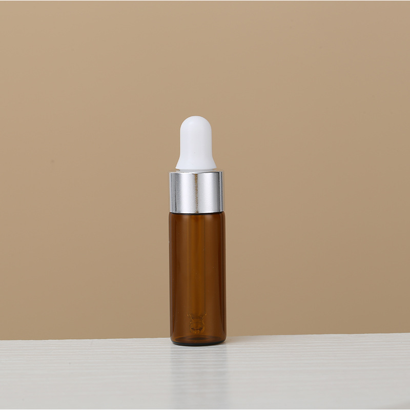 1ml una pieza 3528; botella de color marrón con anillo de plata; vidrio