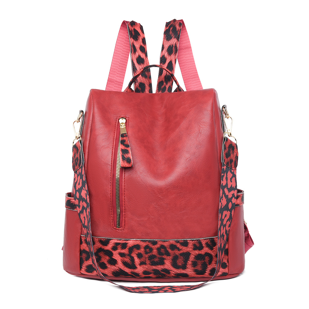 Fabricantes al por mayor 2025 nueva mochila de cuero suave para damas retro europeas y americanas moda estampado de leopardo contraste color bolso de mochila antirrobo