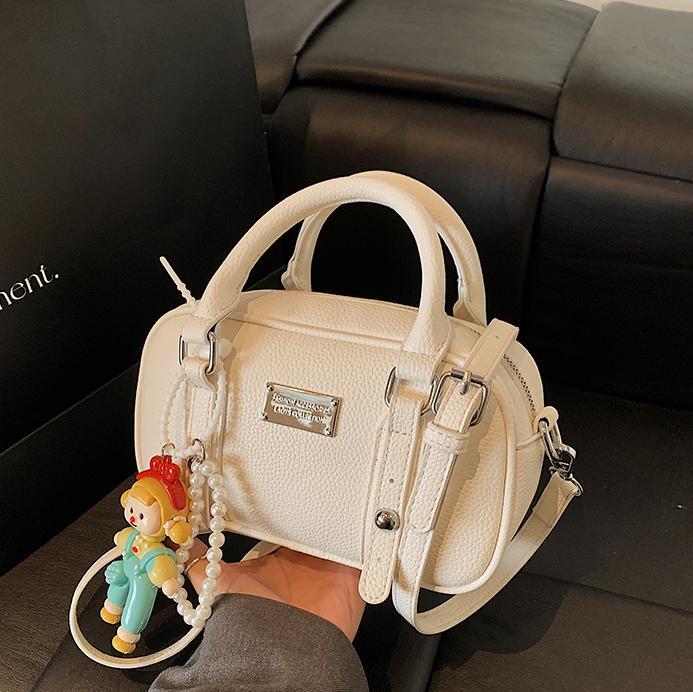 Bolso de bolera de mano de estilo explosivo para mujer 2025 nuevo bolso de hombro de estilo occidental de todo fósforo bolso de mensajero de paso de moda de alta gama