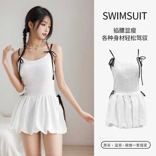 Ladies' French-style white one-piece strap swimsuit with conservative coverage for a slimmer and elegant vacation look