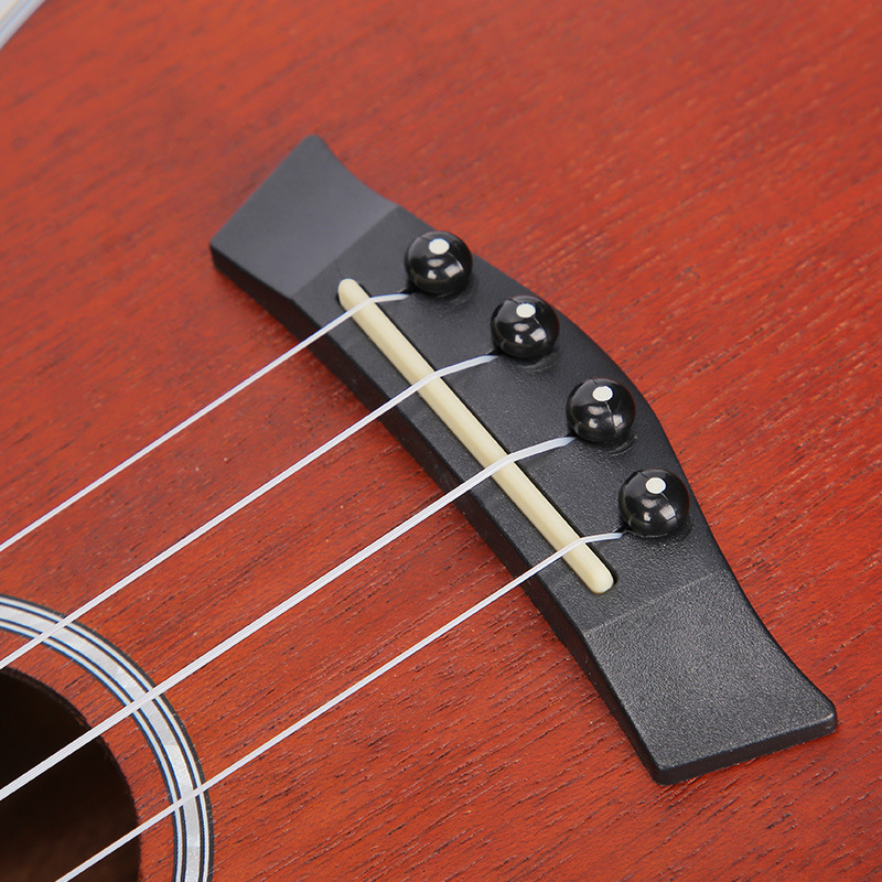 Ukulele 23 pulgadas caoba pequeño ángulo faltante de cuatro cuerdas ukelele guitarra pequeña guitarra eléctrica cabeza instrumento musical al por mayor