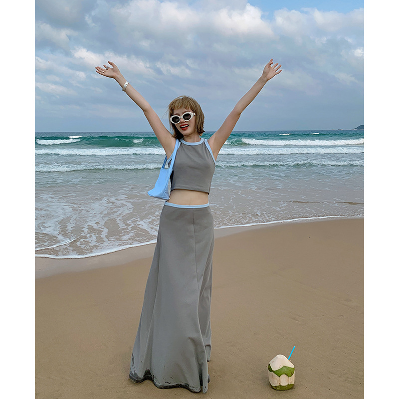 ユニティモードのデザイン感は色にぶつかって透かし彫りの工字の小さいベストの女性の夏のお姉さんの風の熱い辛くて超短い上着です。