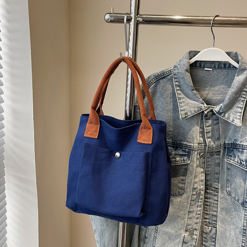 2024 nuevo bolso de lona para mujeres tela japonesa retro simple versátil Harajuku bolso de mano de color sólido casual de moda para mujeres