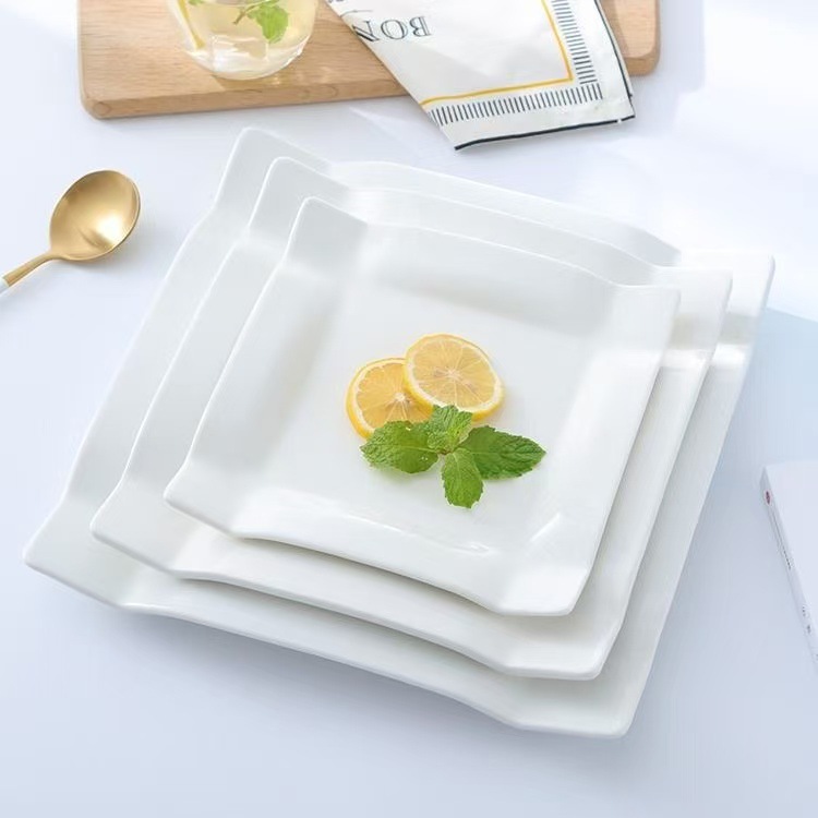 Plato de filete de cerámica plato de forma especial plato en forma de Jigsaw plato de comida occidental plato de bocadillos plato de pastel de hotel blanco puro