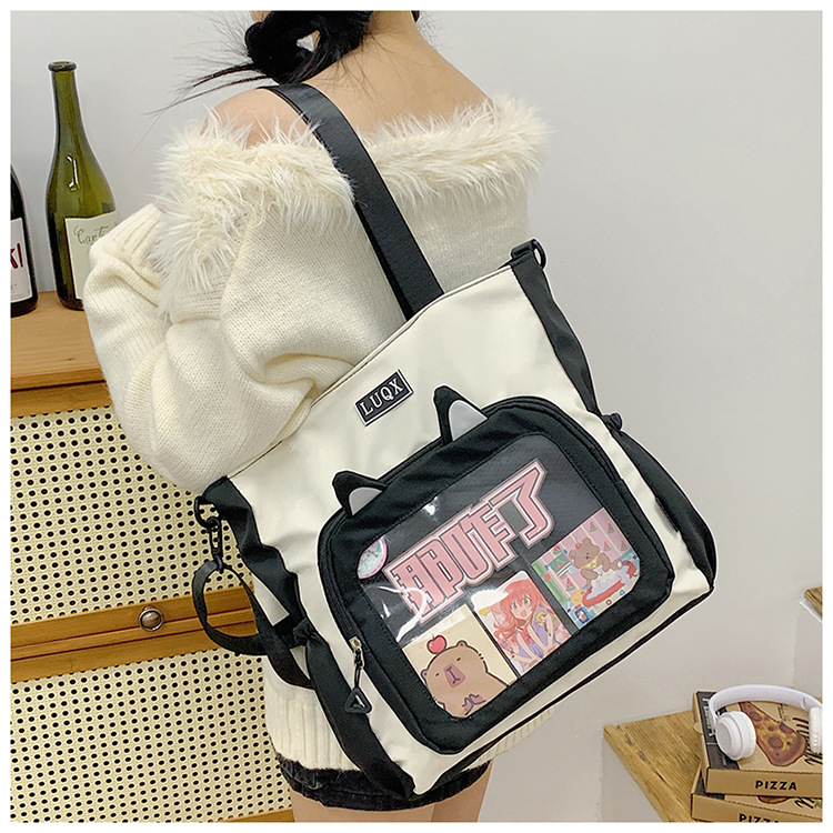 The new cute cartoon printed student bag with a large capacity and transparent student storage single-shoulder bag is selling well for women undefined