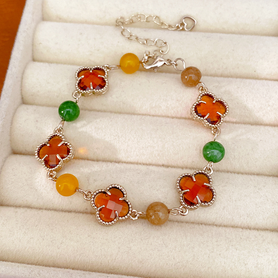 Brazalete de piedra de vidrio de hierba de la suerte ligera de lujo nicho de alta sensación pulsera fresca dulce accesorios de vacaciones joyas de mano