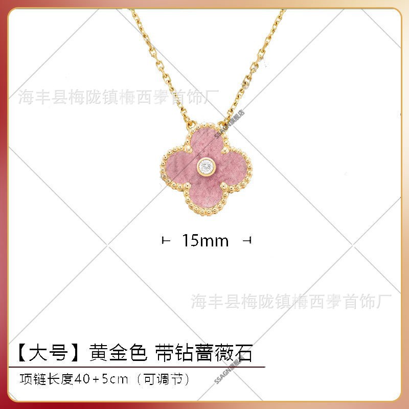 Large four-leaf clover necklace in gold with rose stone and diamonds in the middle
