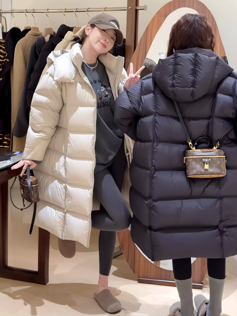 Nube puff suave 90 chaqueta de plumón blanco para mujeres largas rodillas largas gruesas sueltas 2025 nuevo