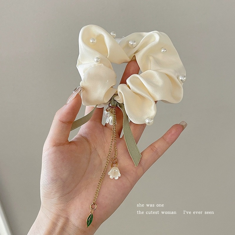 Pastoral viento intestino anillo de cabello mujer 2025 nuevo estilo de alta sensación bola de cabello cuerda de cabeza flor dulce princesa adornos de cabello cuerda