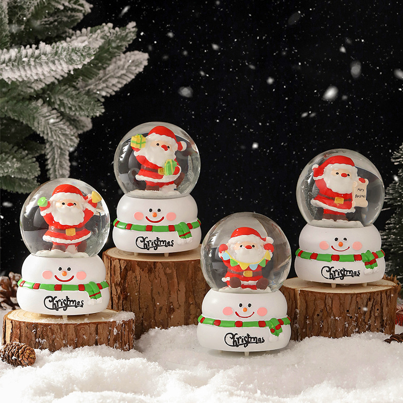 Una variedad de regalos de decoración de Navidad Navidad iluminante bola de cristal caja de música ventana diseño de velas lámparas de viento árbol de Navidad