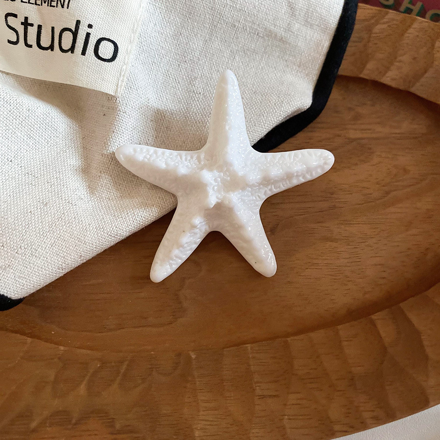 Vacaciones junto al mar viento estrella de mar horquilla moda tendencia de fotografía lateral clip de pico de pato sentido de alta gama accesorios para el cabello de todo fósforo mujeres